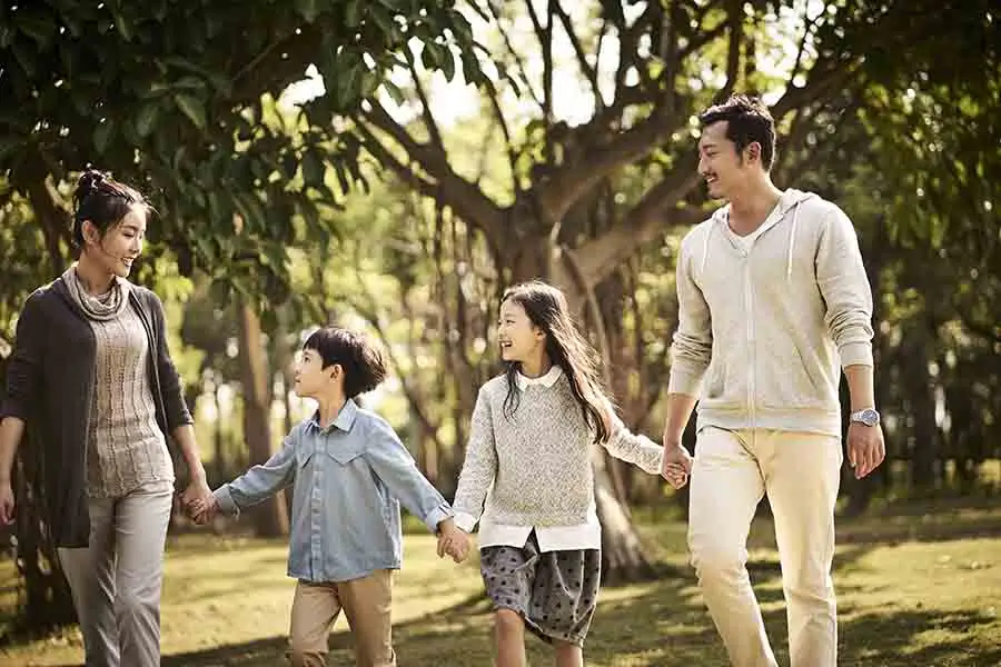 asian singapore pr family of 4 in a park
