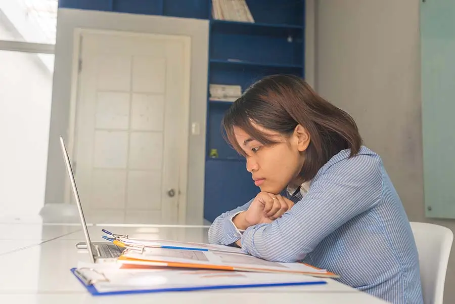 lady examining pr application cases on clipboards